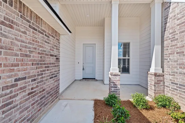 a view of front door of house with stairs