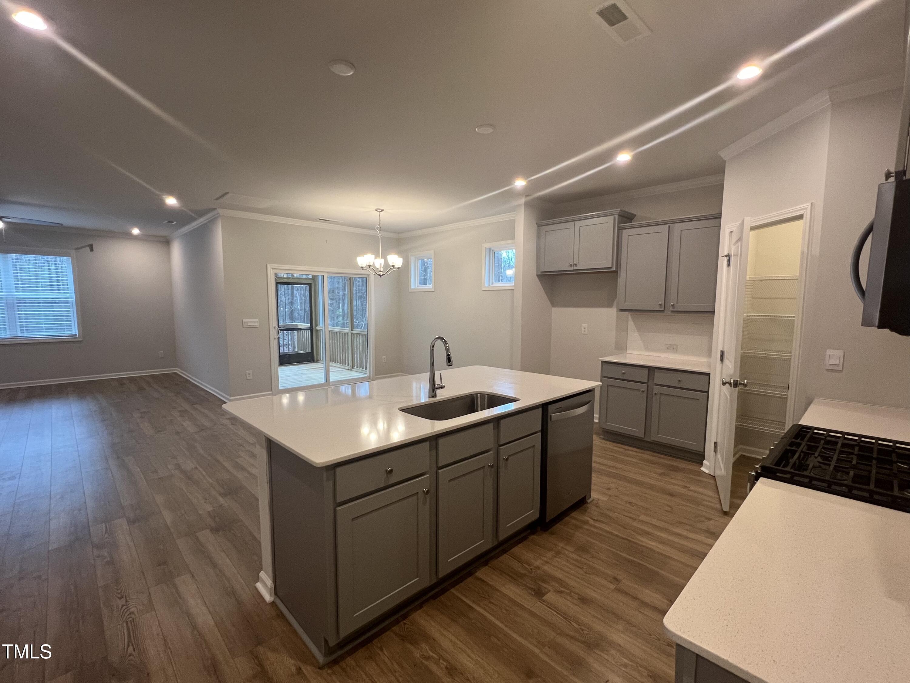 117 Clear Water Road Louisburg, NC 27549 - Photo 11 of 34 a kitchen with a sink stove and cabinets