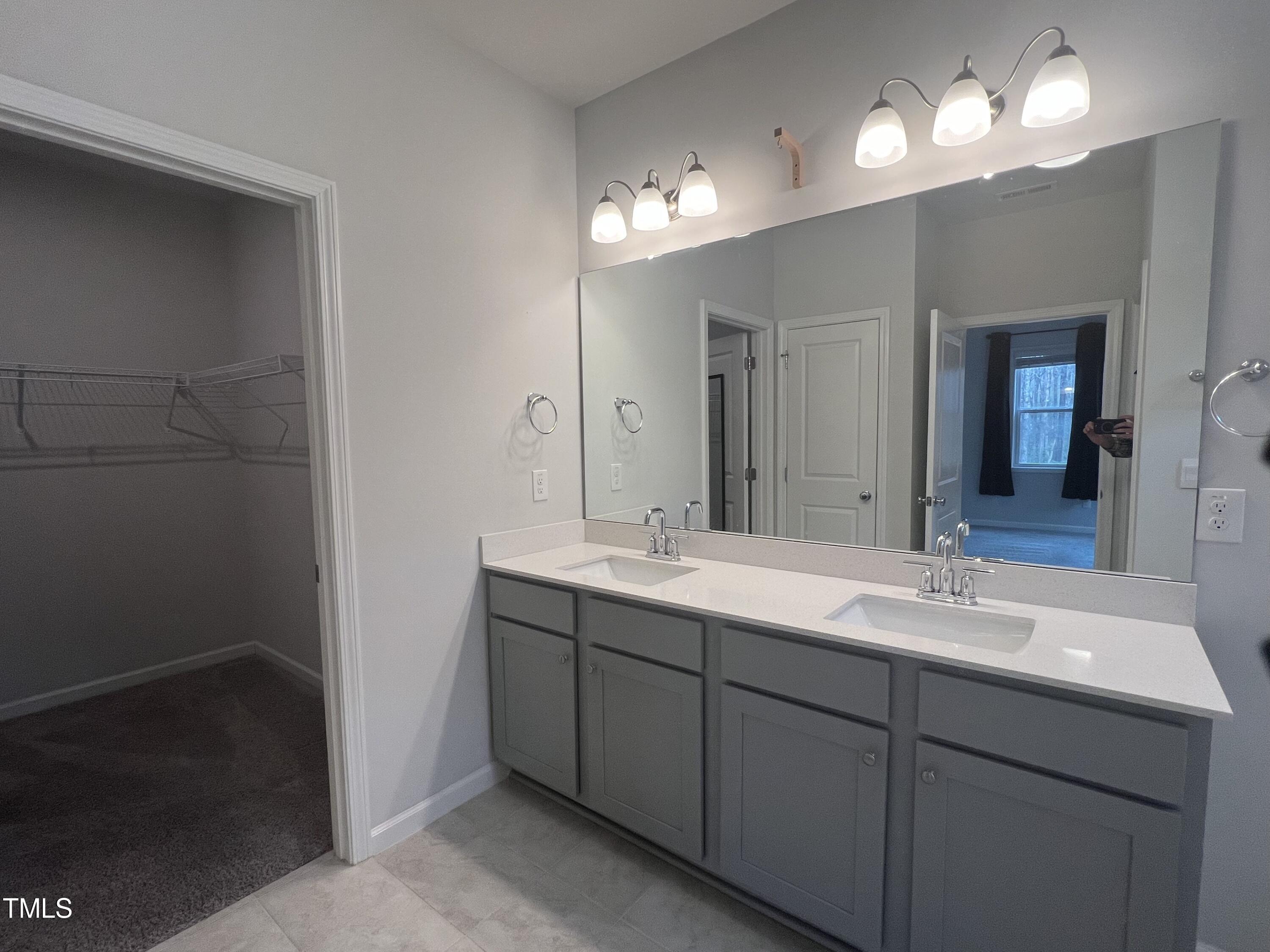 117 Clear Water Road Louisburg, NC 27549 - Photo 19 of 34 a bathroom with a sink and a mirror