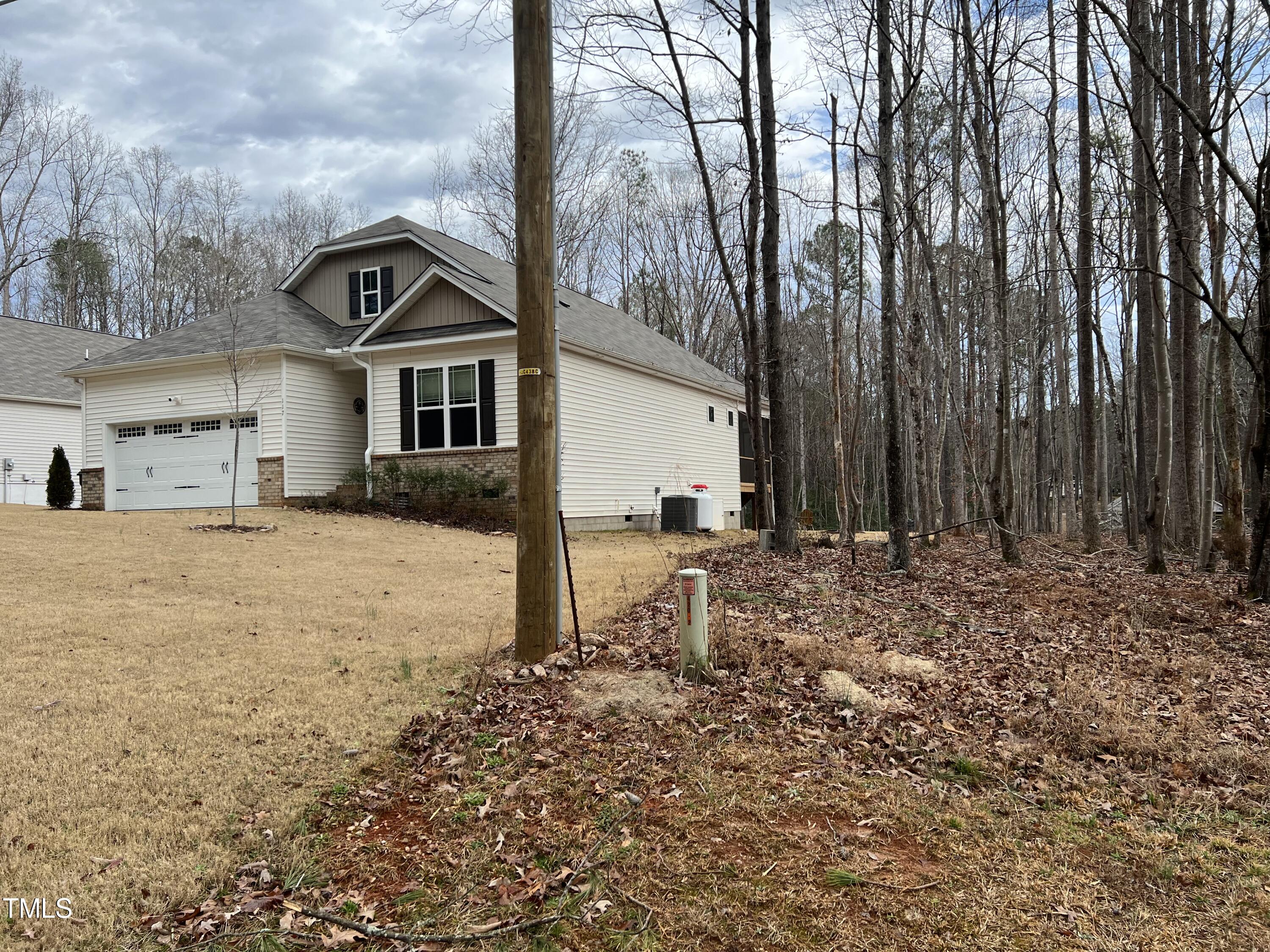 117 Clear Water Road Louisburg, NC 27549 - Photo 2 of 34 a view of a house with a yard covered in snow