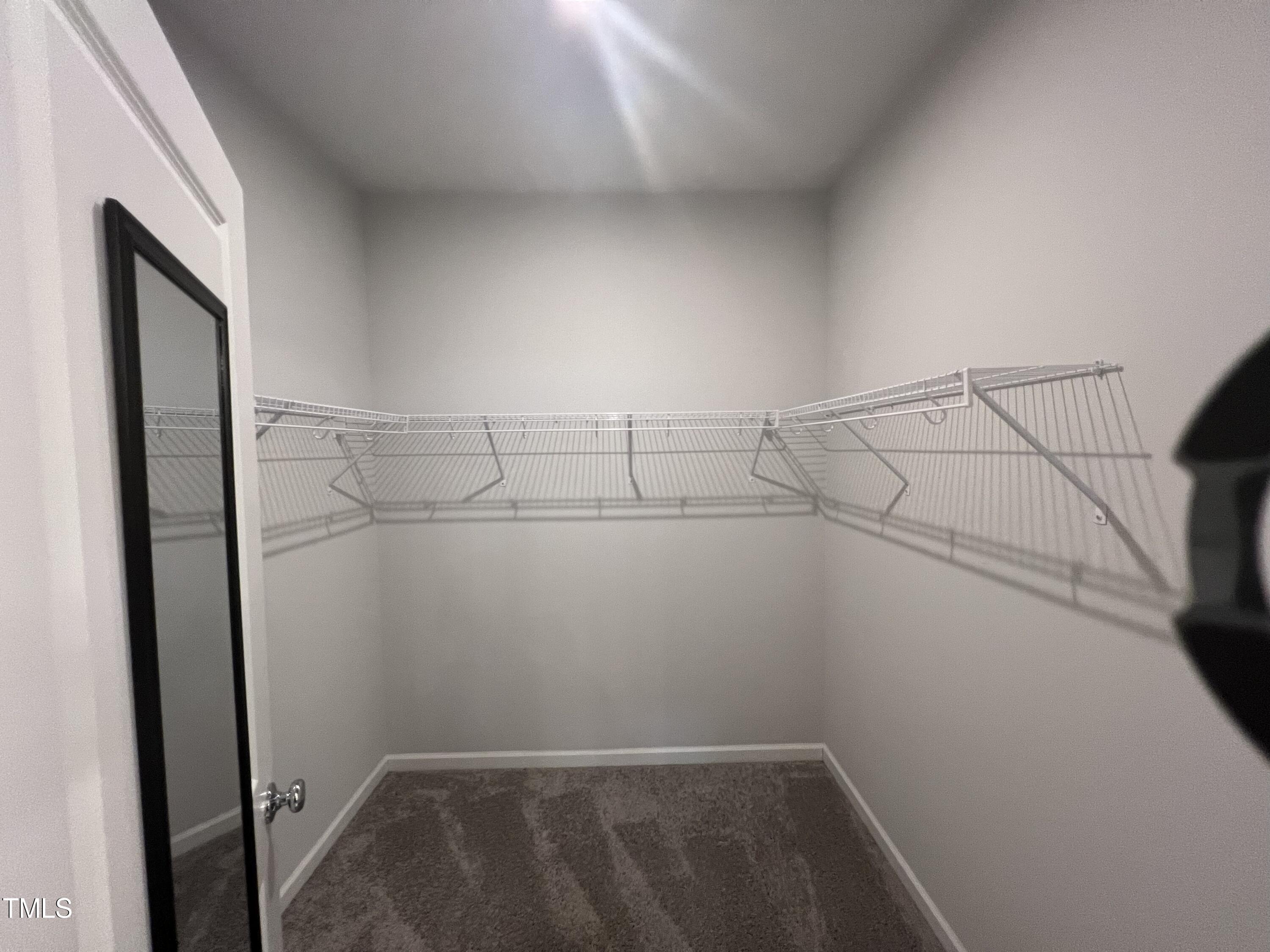 117 Clear Water Road Louisburg, NC 27549 - Photo 21 of 34 a view of a room with racks on the wall