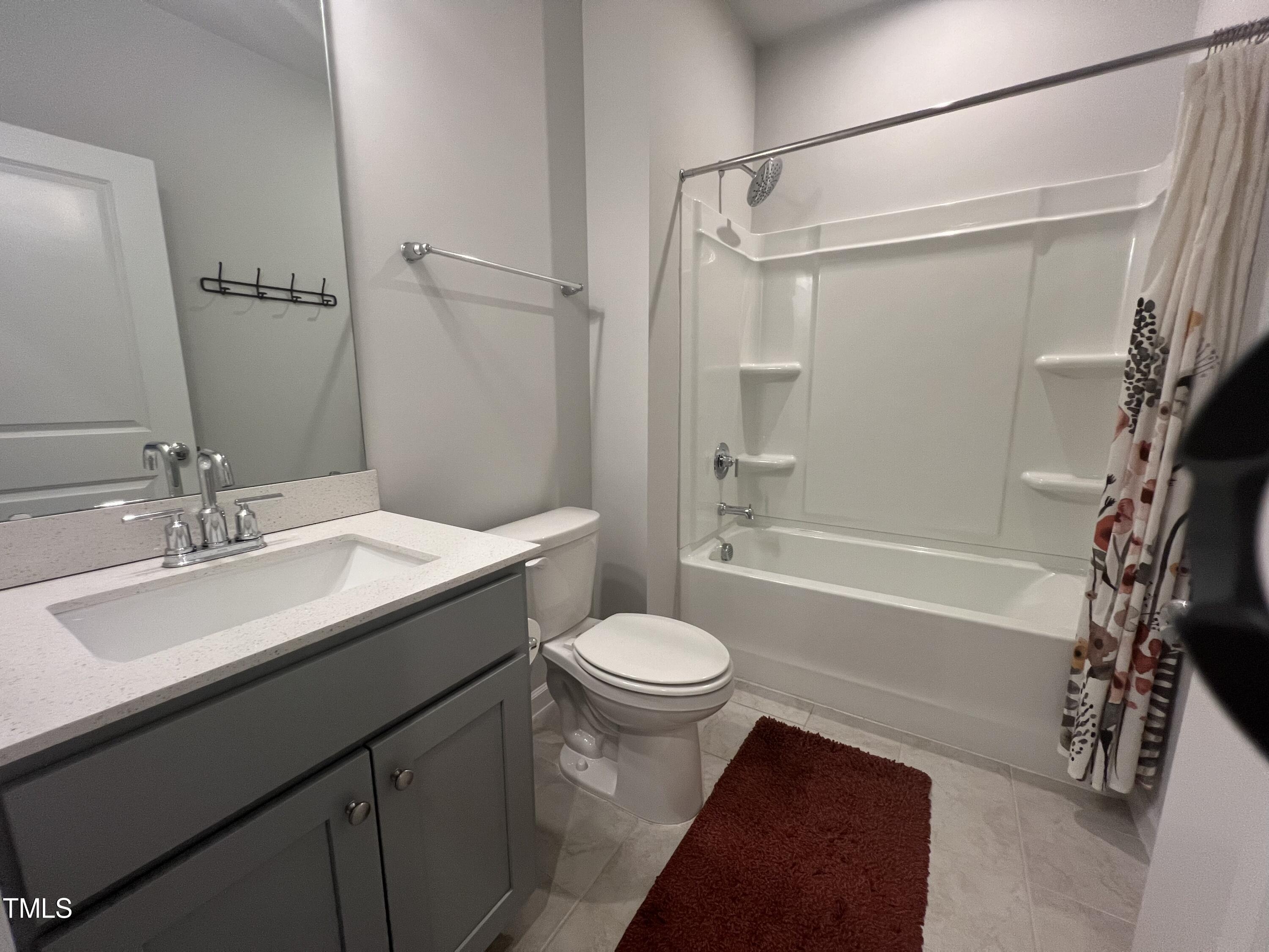 117 Clear Water Road Louisburg, NC 27549 - Photo 23 of 34 a bathroom with a sink toilet vanity and shower