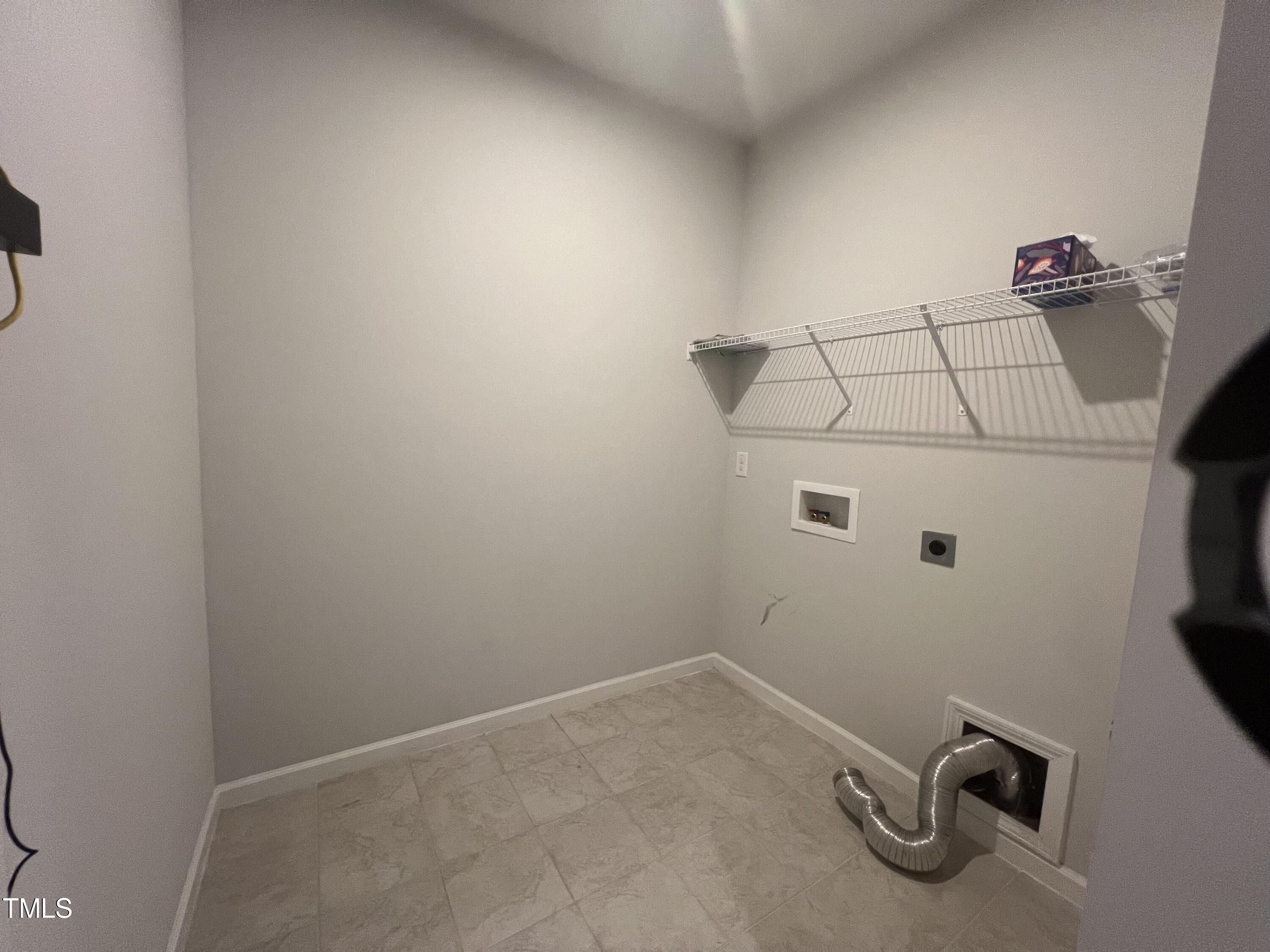 117 Clear Water Road Louisburg, NC 27549 - Photo 26 of 34 a view of a room with rack on the wall