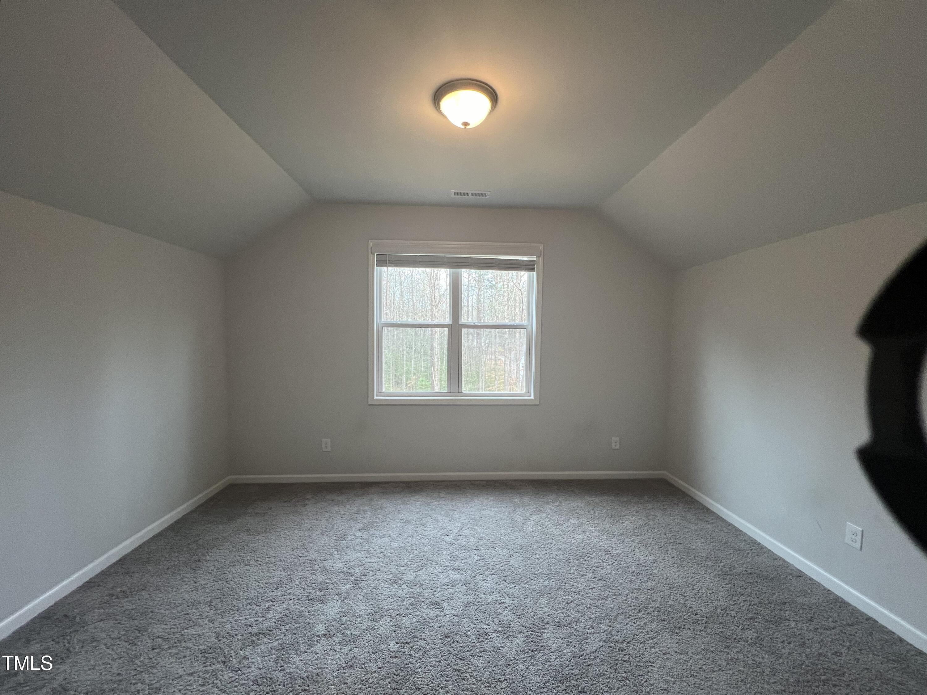 117 Clear Water Road Louisburg, NC 27549 - Photo 31 of 34 an empty room with a window