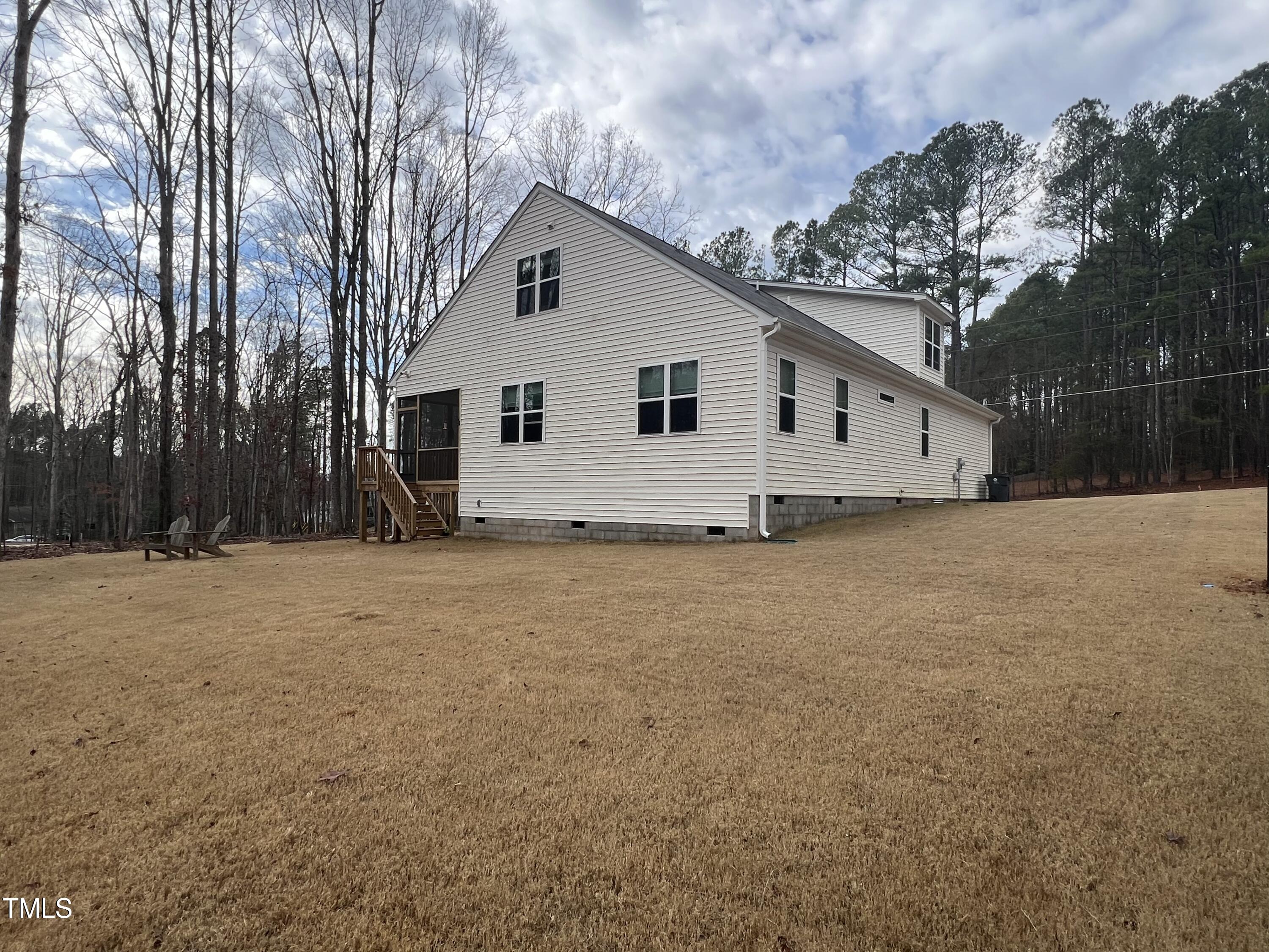 117 Clear Water Road Louisburg, NC 27549 - Photo 7 of 34 a view of a house with a backyard