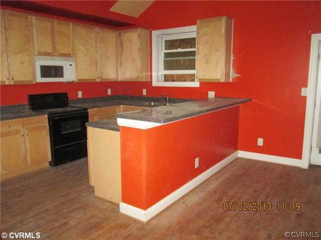 1417 Decatur Street Richmond, VA 23224 - Photo 5 of 8 a kitchen with stainless steel appliances granite countertop a sink stove and cabinets