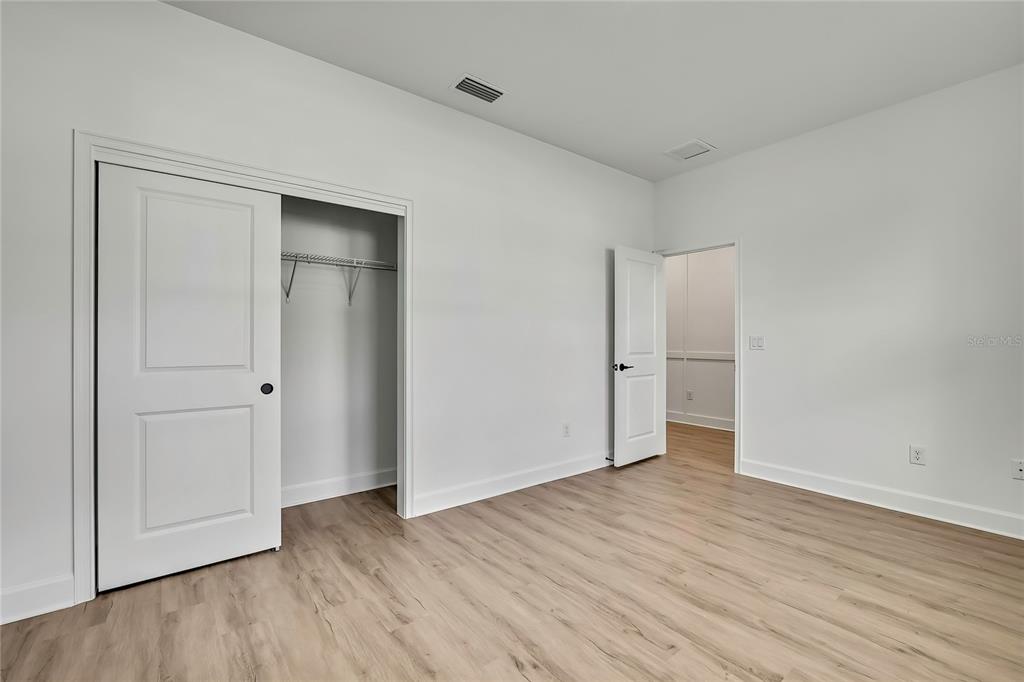 6589 Freeport Drive Spring Hill, FL 34608 - Photo 39 of 63 a view of an empty room and wooden floor