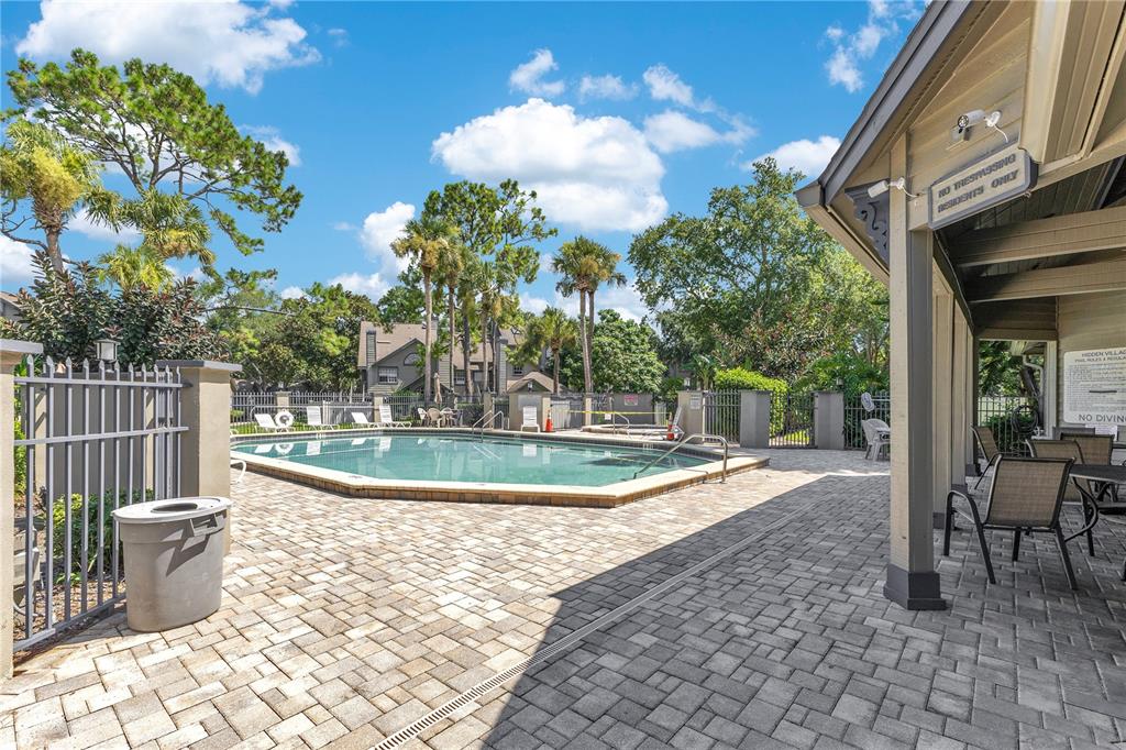 955 Forest Ridge Court, Unit 203 Lake Mary, FL 32746 - Photo 26 of 26 a view of a backyard with fountain