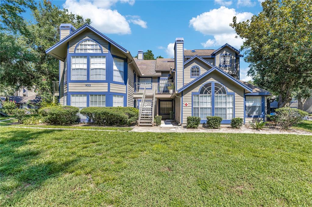 955 Forest Ridge Court, Unit 203 Lake Mary, FL 32746 - Photo 3 of 26 a front view of a house with a yard