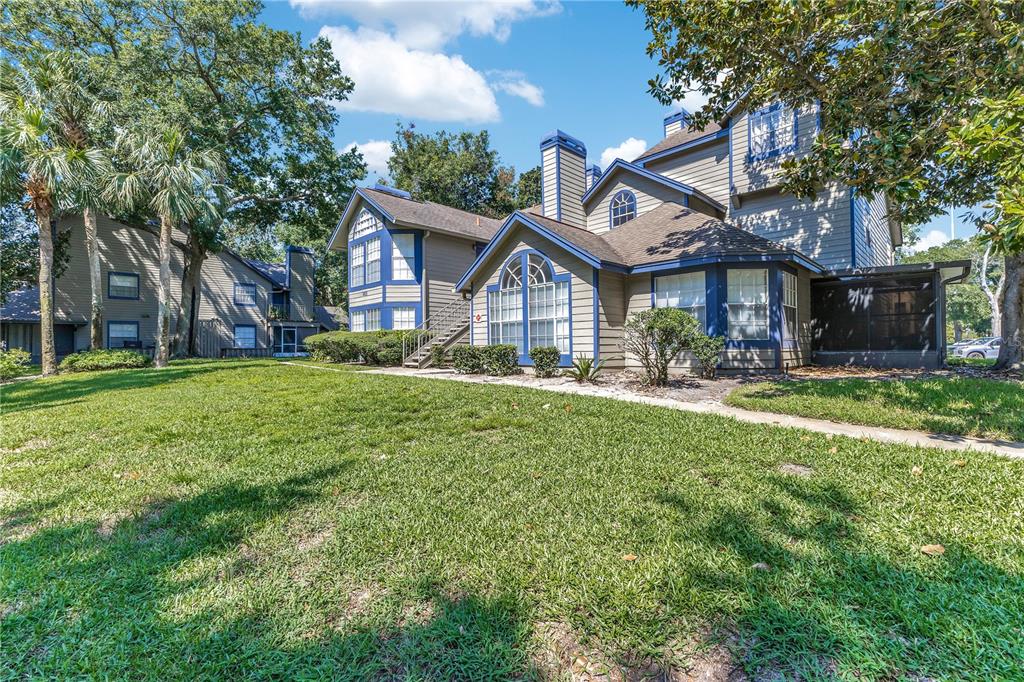 955 Forest Ridge Court, Unit 203 Lake Mary, FL 32746 - Photo 4 of 26 a front view of a house with garden