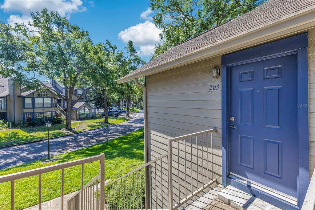 955 Forest Ridge Court, Unit 203 Lake Mary, FL 32746 - Photo 6 of 26 a view of a porch with a backyard
