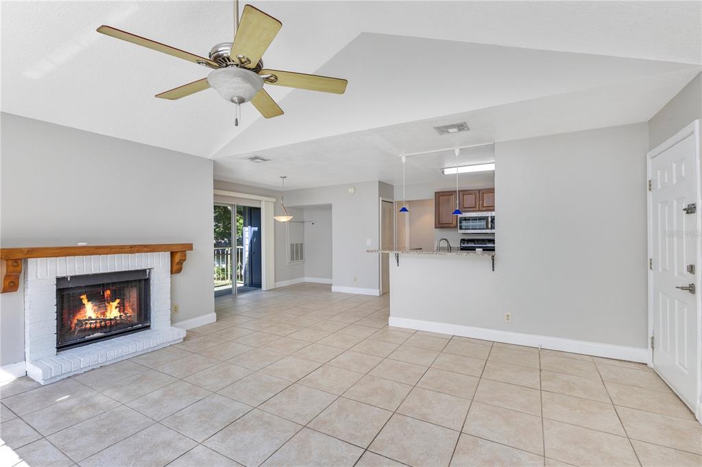 955 Forest Ridge Court, Unit 203 Lake Mary, FL 32746 - Photo 8 of 26 a view of an empty room and fire place