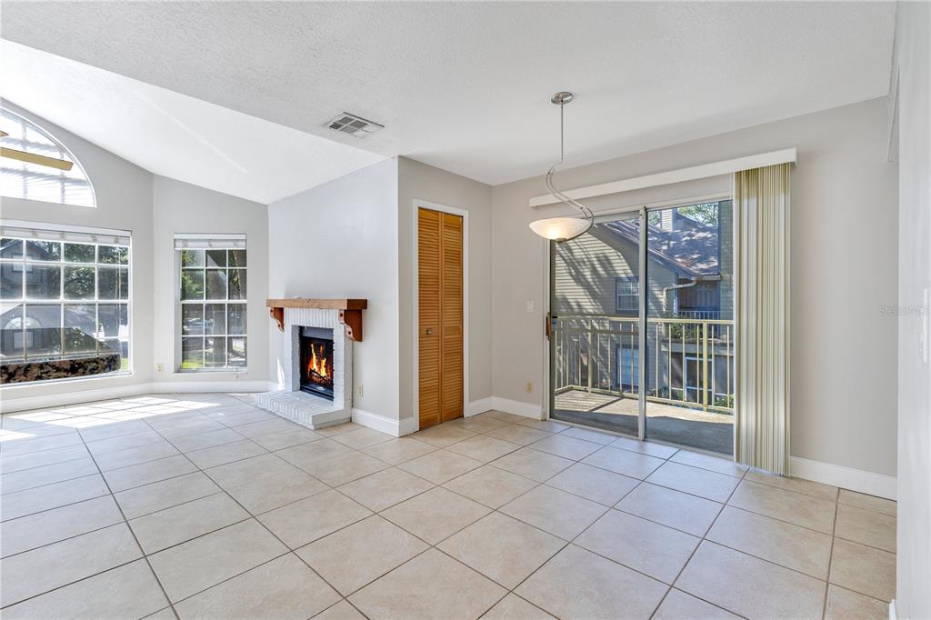 955 Forest Ridge Court, Unit 203 Lake Mary, FL 32746 - Photo 9 of 26 a view of empty room with wooden floor and fan