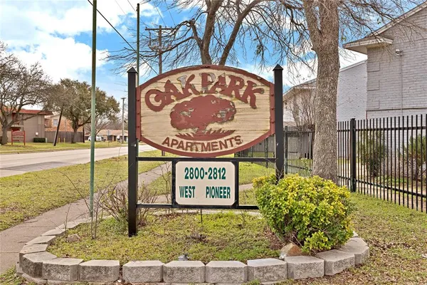 a sign on a pole on a street