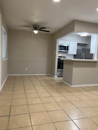 a view of a kitchen with a sink and a stove top oven