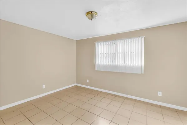 a view of an empty room with windows