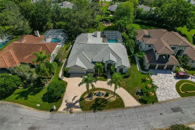 an aerial view of a house with garden space and street view