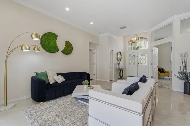 a kitchen with a dining table chairs and refrigerator