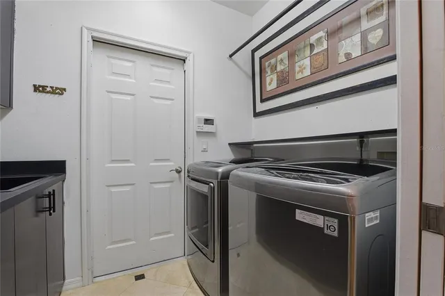 a bedroom with a large bed and a large window