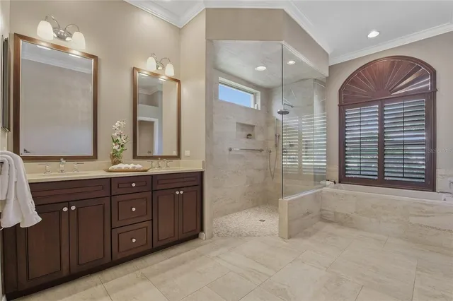 a view of a livingroom with wooden floor and a flat screen tv