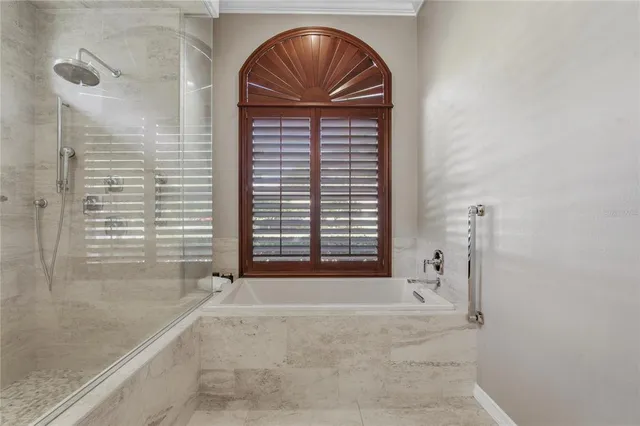 a bathroom with a glass shower door