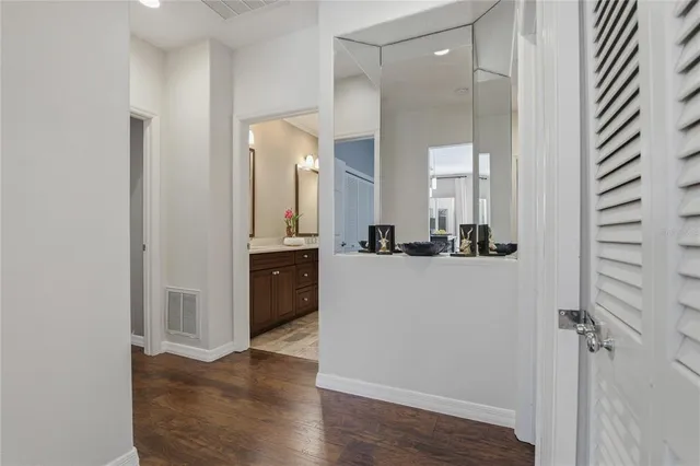 a bedroom with a bed lamp and window