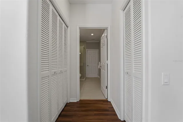 an aerial view of a house with garden space and street view