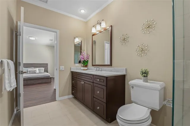 an aerial view of a house with a yard and green space