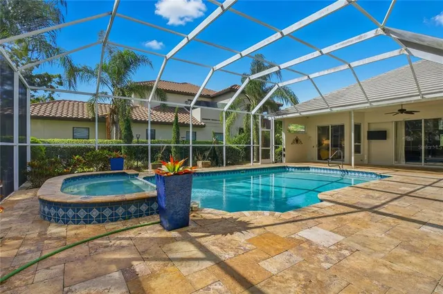 an aerial view of a house with garden space and street view