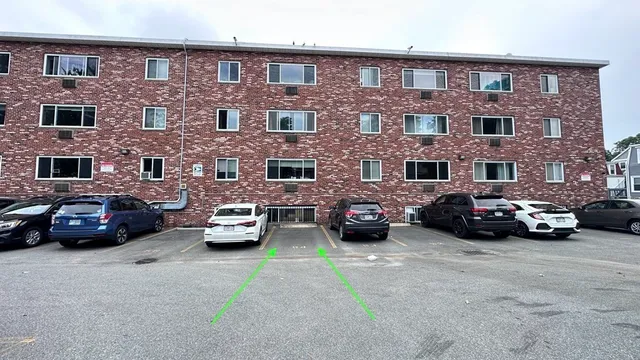 a view of a cars parked in front of a building