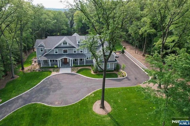 a aerial view of a house with a yard