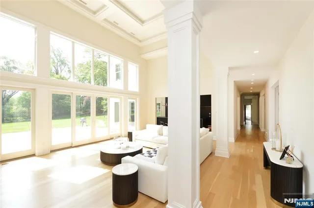 a lobby with furniture and floor to ceiling windows