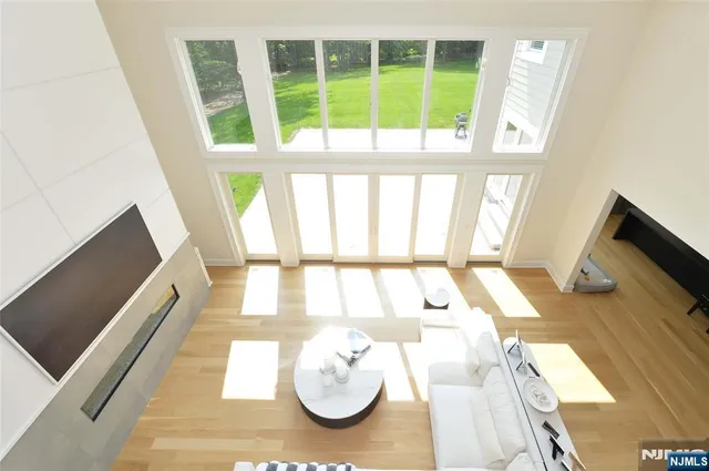 a bathroom with a bathtub and a large window