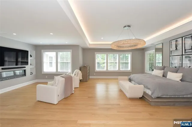 a spacious bedroom with a large bed and a couch