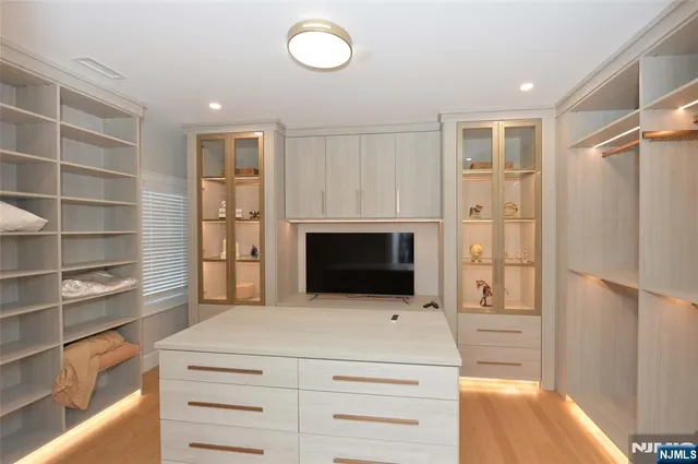 a kitchen with a refrigerator and a oven