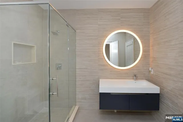 a bathroom with a sink and a mirror