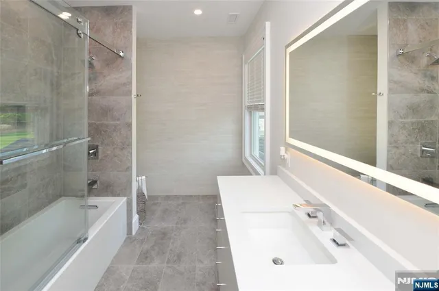 a bathroom with a sink and a bathtub