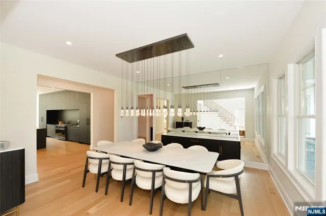 a dining room with furniture and wooden floor