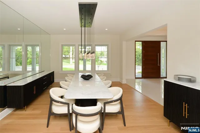 a view of a dining room with furniture and window