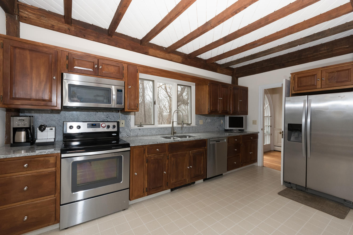 108 Long Neck Point Road Darien, CT 06820 - Photo 13 of 39 a kitchen with stainless steel appliances granite countertop a stove microwave and refrigerator