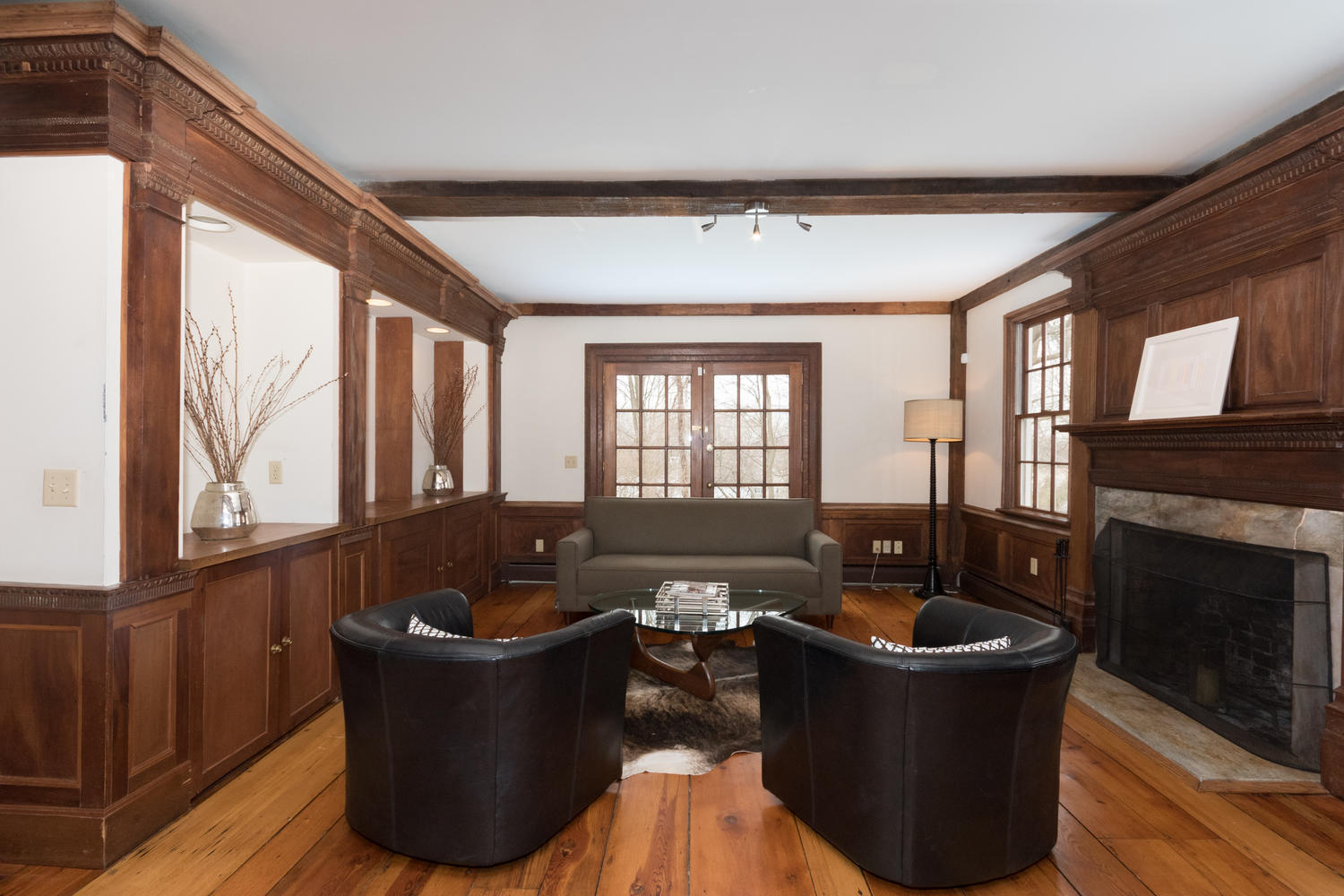 108 Long Neck Point Road Darien, CT 06820 - Photo 16 of 39 a living room with furniture and a fireplace