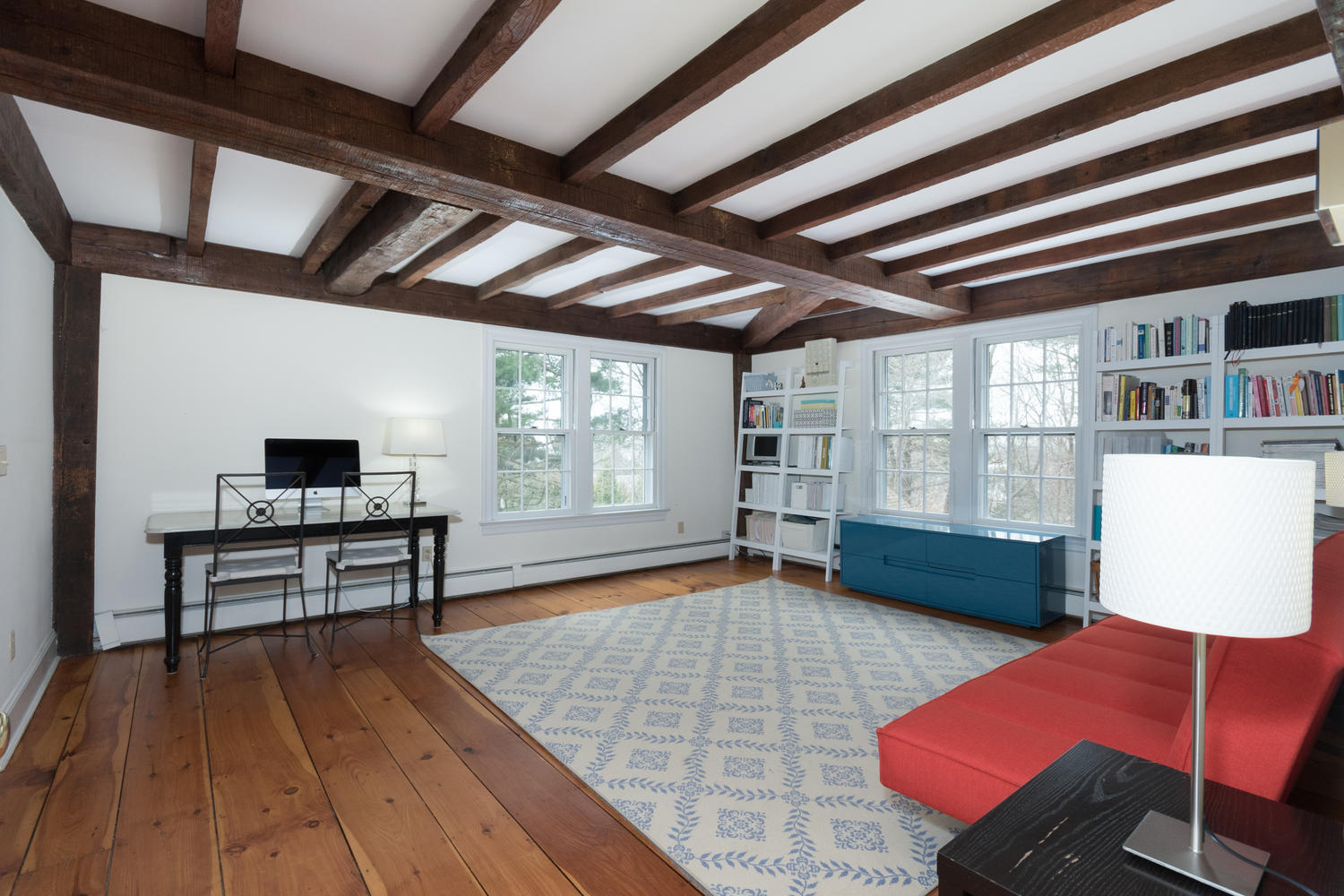 108 Long Neck Point Road Darien, CT 06820 - Photo 20 of 39 a room with furniture and a wooden floor
