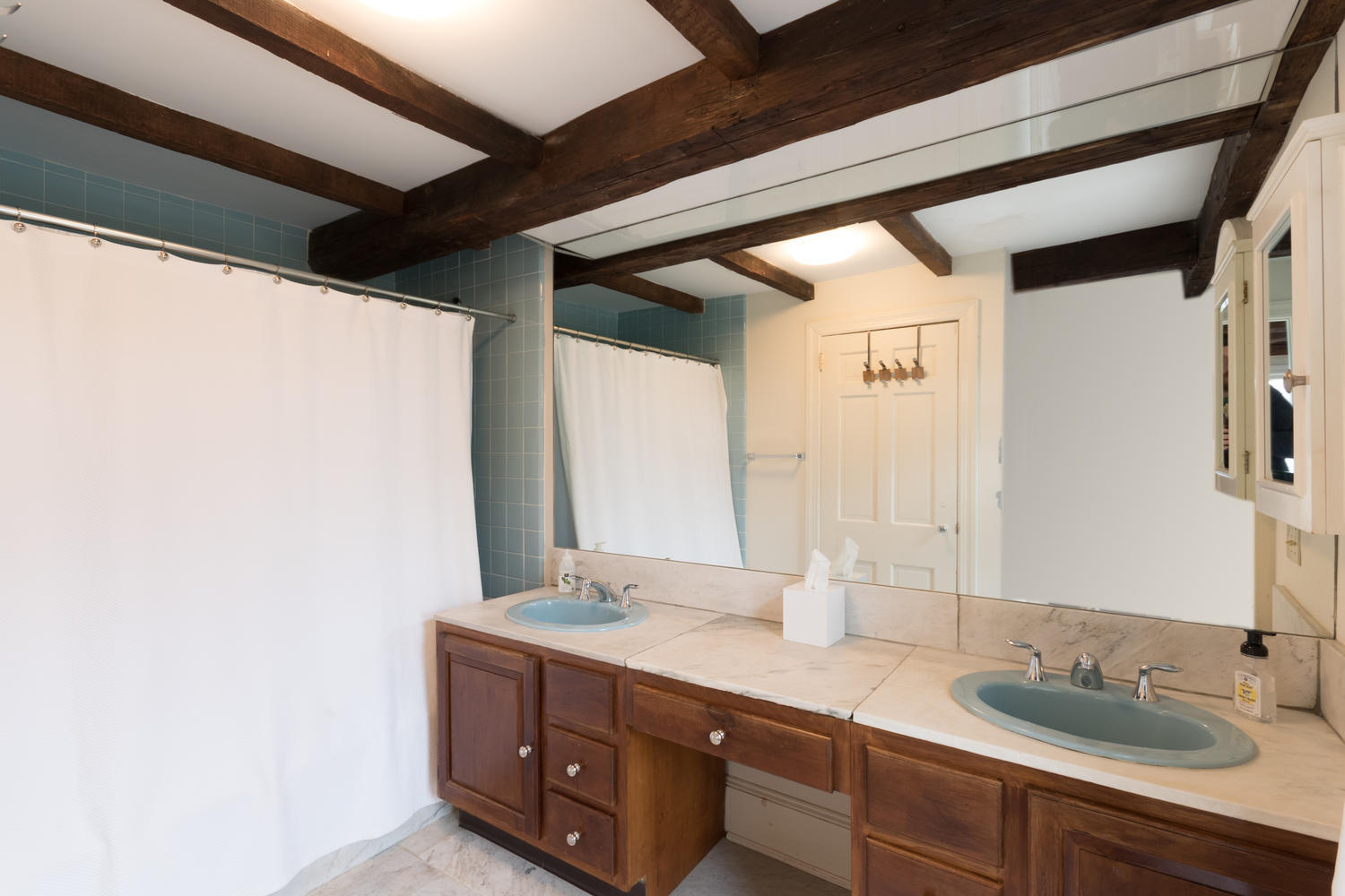 108 Long Neck Point Road Darien, CT 06820 - Photo 22 of 39 a bathroom with a double vanity sink and a mirror