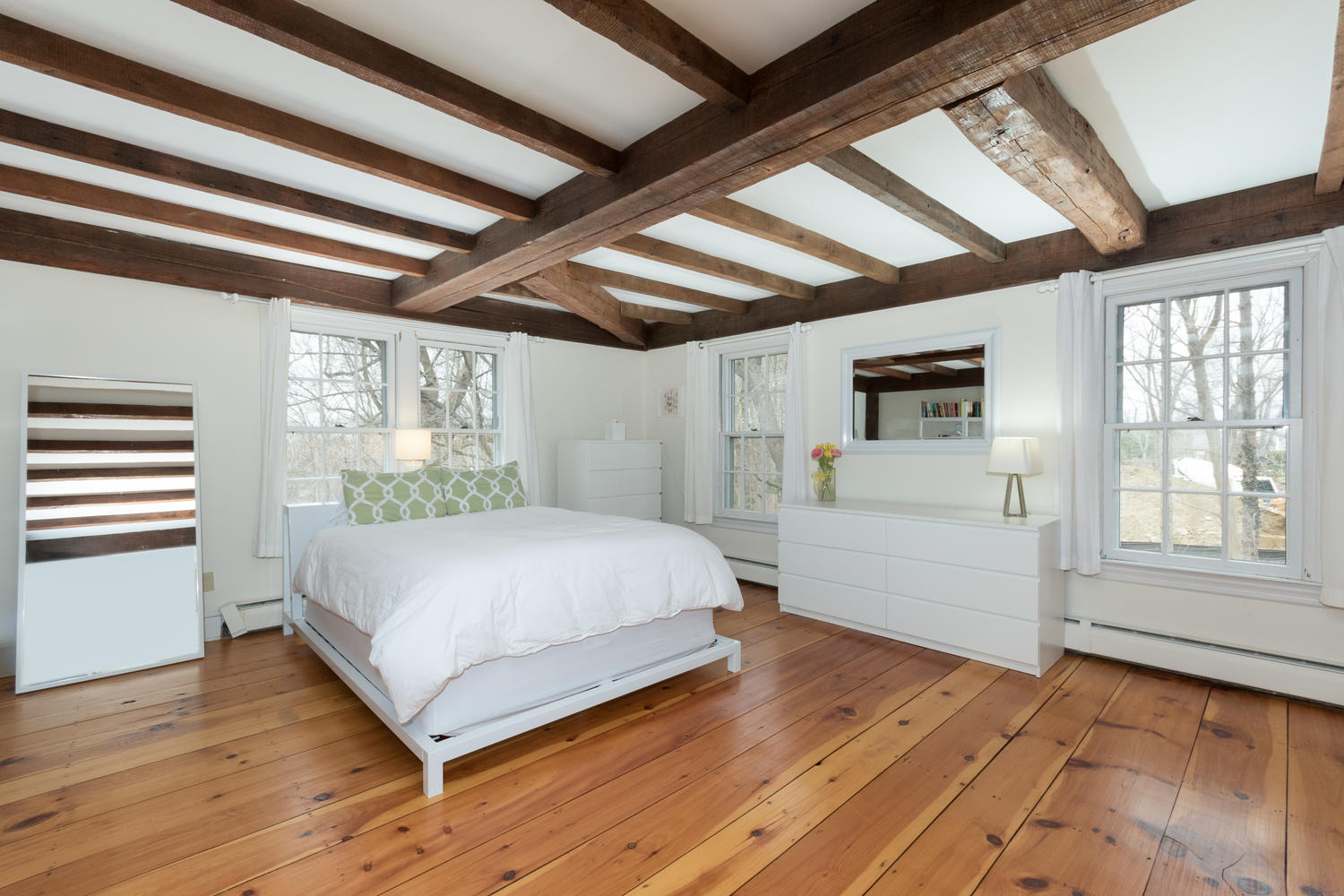 108 Long Neck Point Road Darien, CT 06820 - Photo 23 of 39 a bedroom with a large bed and a window