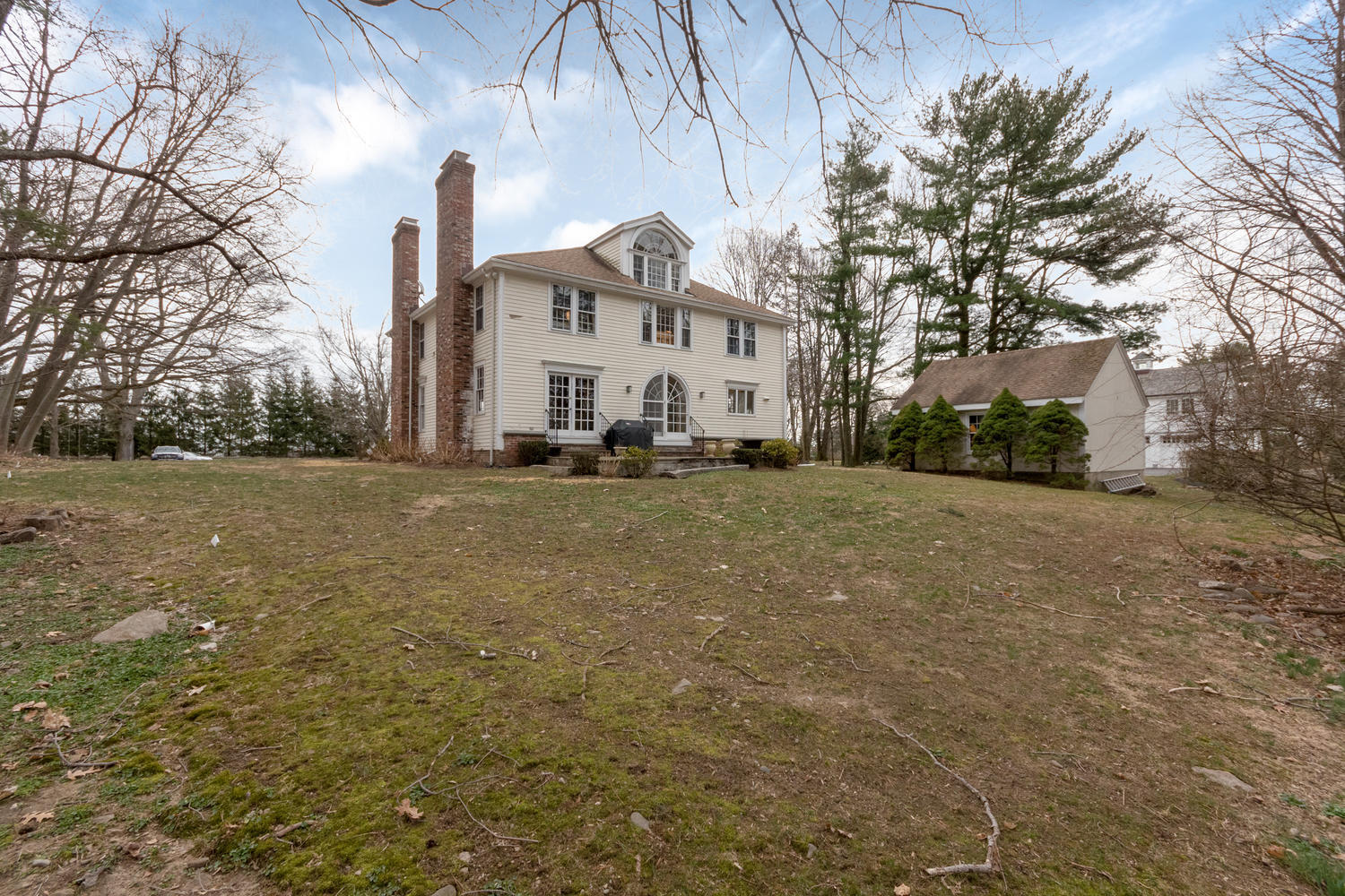 108 Long Neck Point Road Darien, CT 06820 - Photo 33 of 39 a view of a white house with a yard