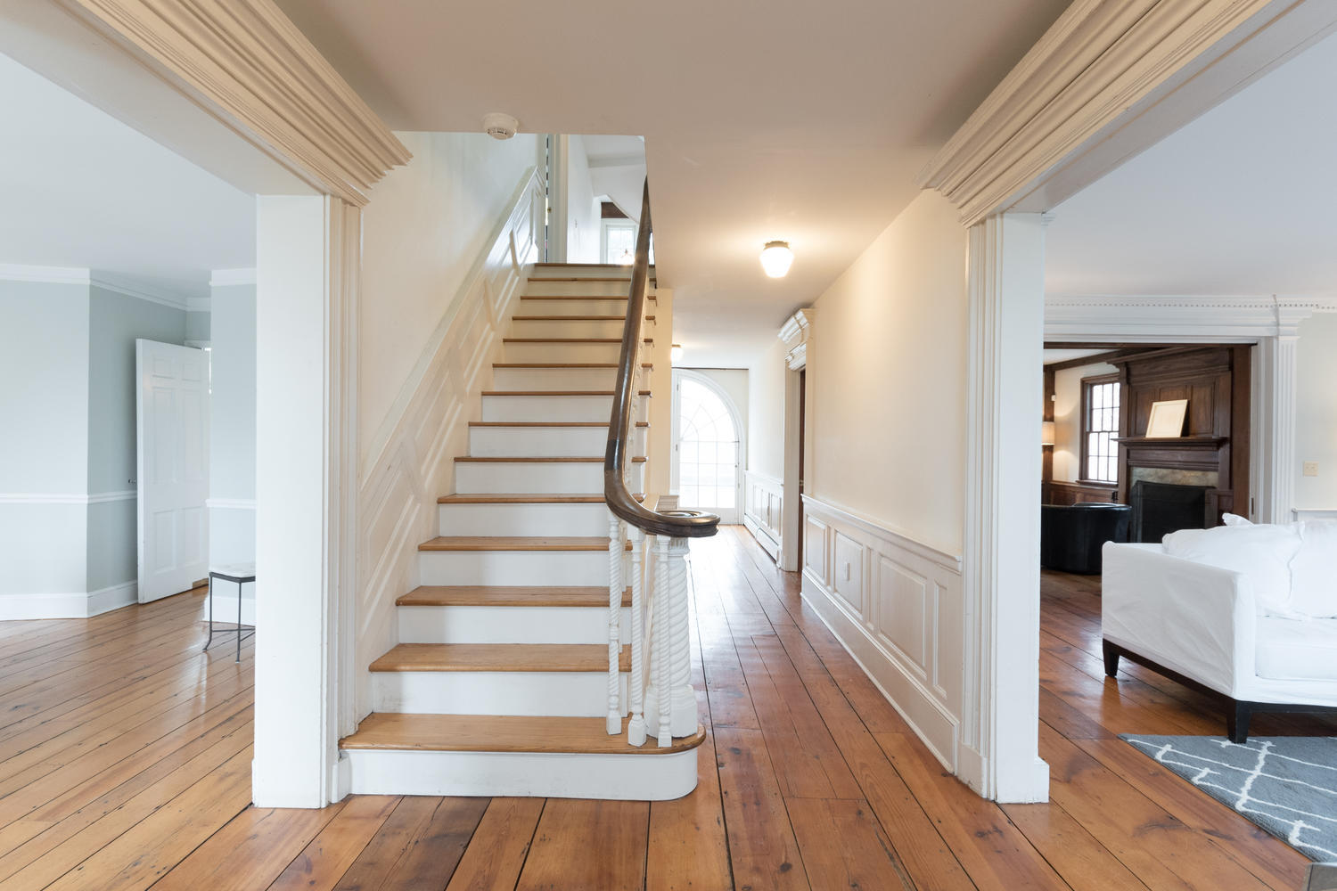 108 Long Neck Point Road Darien, CT 06820 - Photo 6 of 39 a view of a room with wooden floor and stairs