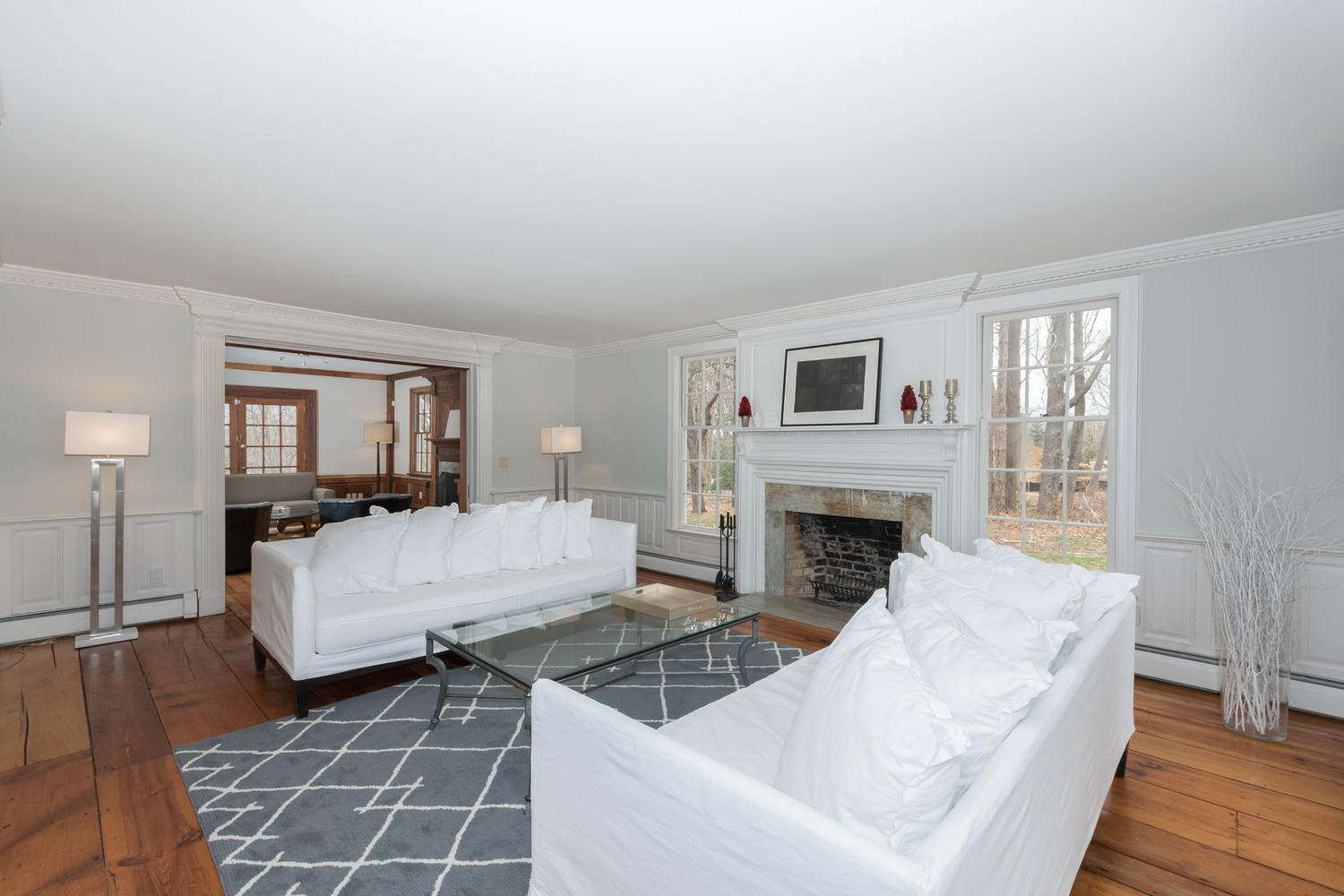 108 Long Neck Point Road Darien, CT 06820 - Photo 7 of 39 a living room with furniture and a fireplace
