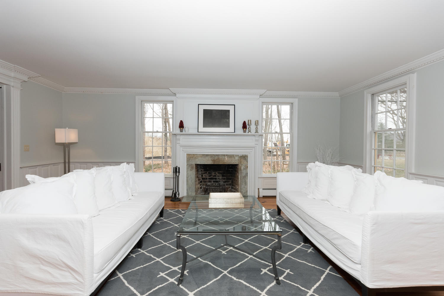 108 Long Neck Point Road Darien, CT 06820 - Photo 9 of 39 a living room with a couch and a fireplace