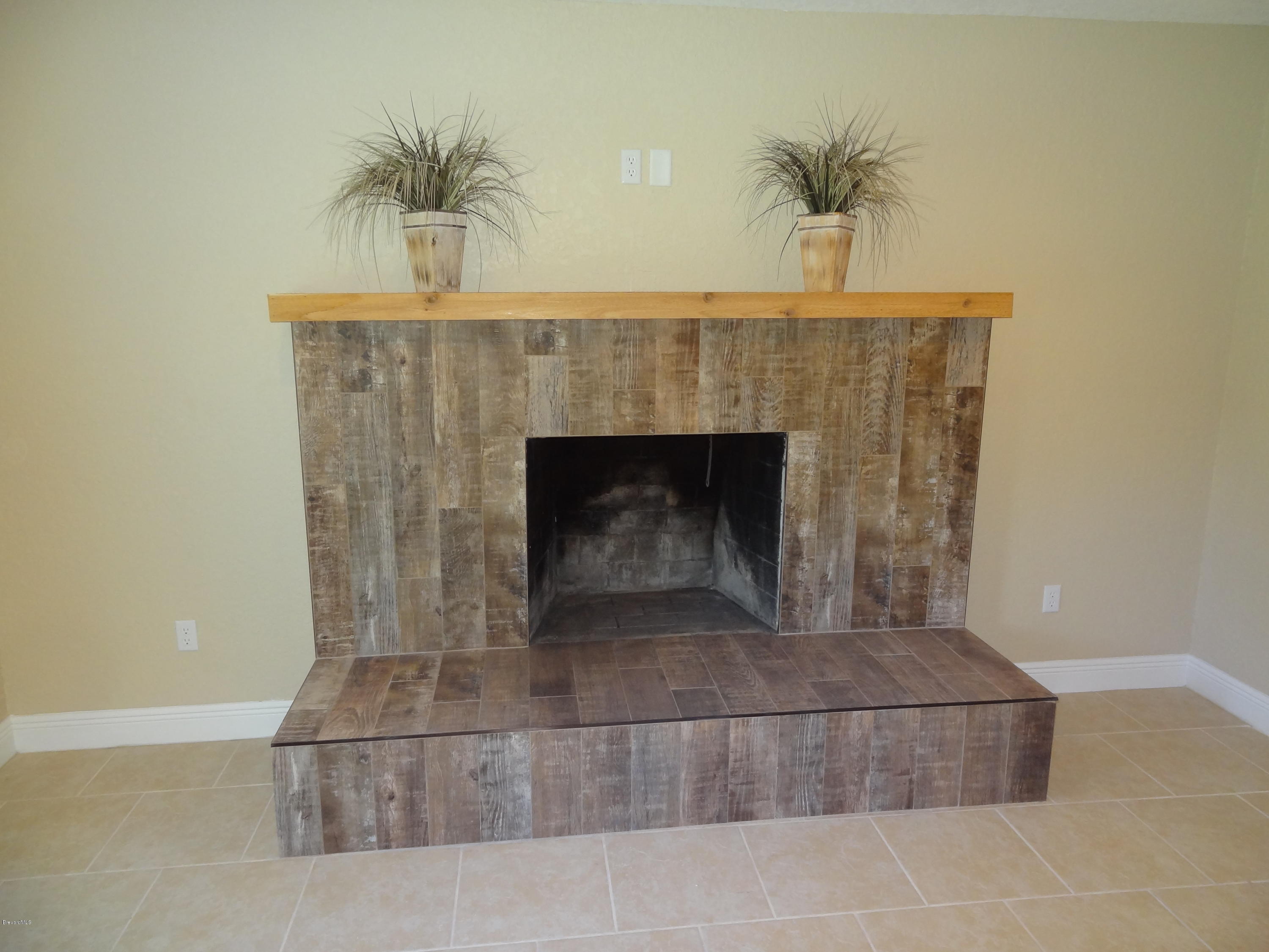 2272 Laden Road Melbourne, FL 32935 - Photo 30 of 39 Beautiful Fireplace wired for TV
