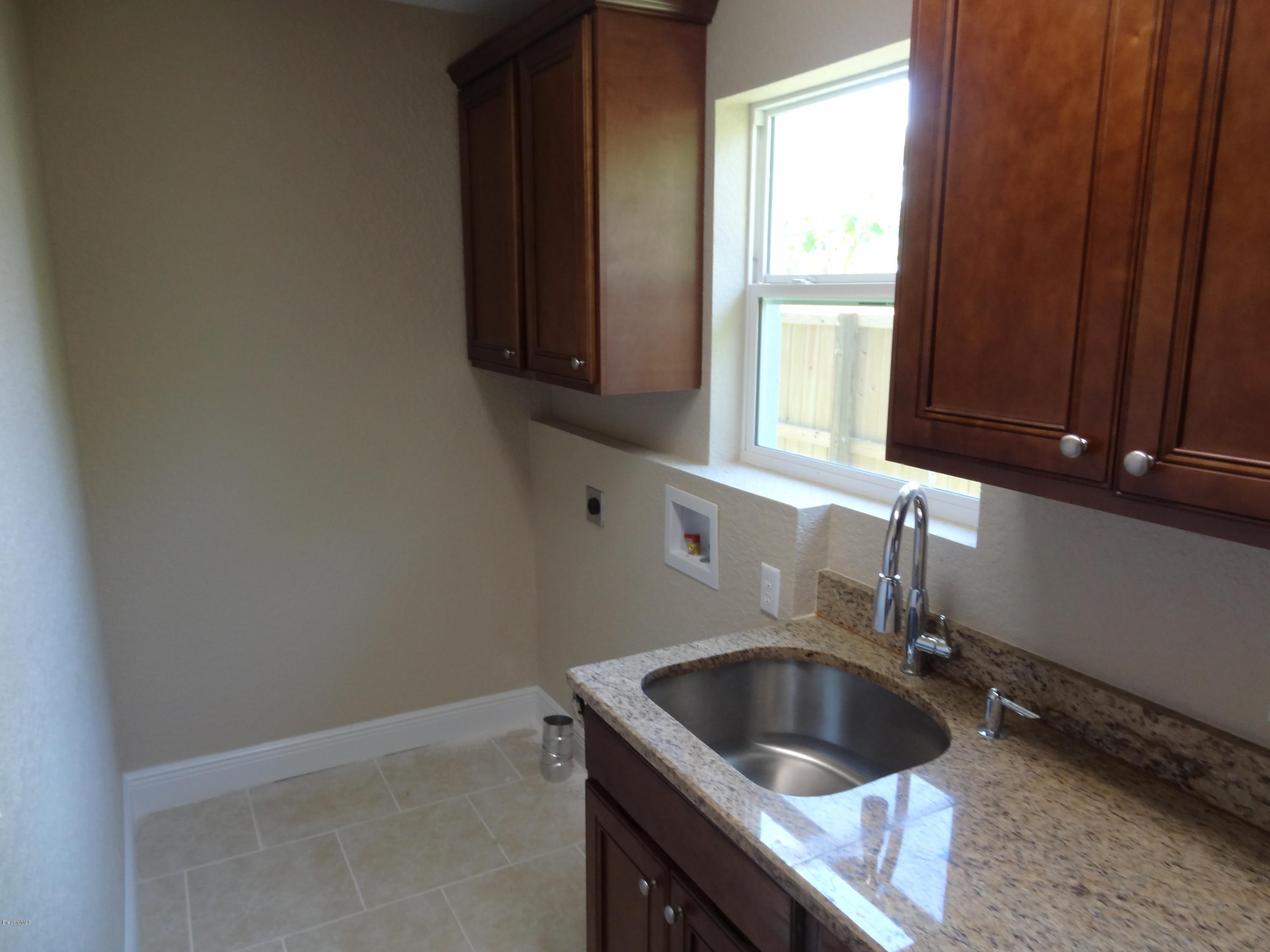 2272 Laden Road Melbourne, FL 32935 - Photo 31 of 39 Inside Laundry Room